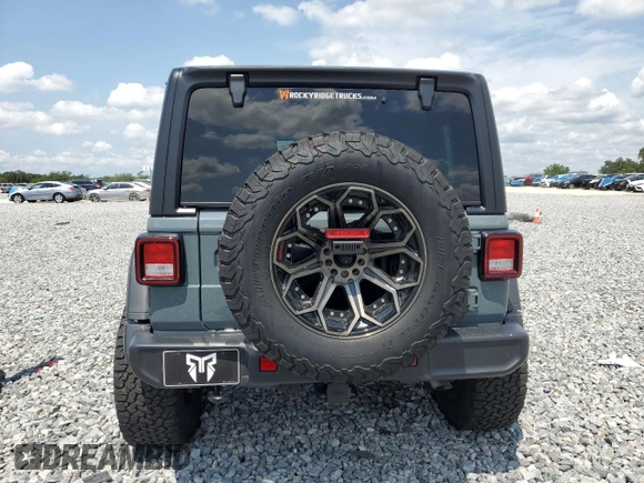 2024 Jeep Wrangler Sport S with VIN 1C4PJXDG3RW229567, listed as a Copart auction lot 55307335 with 7,797 mi miles and Salvage Title. Bid and sale history available at DreamBid. Image 6.