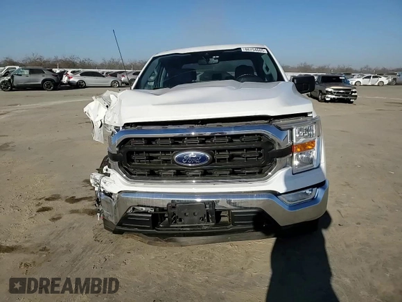 2021 Ford F-150 XL with VIN 1FTEW1CP8MFD11312, listed as a Copart auction lot 88754605 with 142,224 mi miles and Salvage title. Bid and sale history available at DreamBid. Image 11.