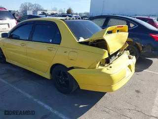 2003 Mitsubishi Lancer OZ-Rally with VIN JA3AJ86E23U079315, listed as a IAAI auction lot 41408040 with 130,356 mi miles. Bid and sale history available at carsss.com. Image 3.