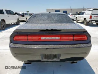 2014 Dodge Challenger R/T Plus z VIN 2C3CDYBT0EH122467, wystawiony jako Copart lot #58392365 z przebiegiem 136 793 mil mil oraz Szkoda całkowita • Salvage title. Historia ofert i sprzedaży dostępna na DreamBid. Obrazek 6.