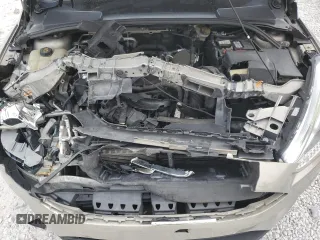 2016 Ford Focus SE z VIN 1FADP3F20GL267077, wystawiony jako Copart lot #53649665 z przebiegiem 106 329 mil mil oraz Szkoda całkowita • Salvage title. Historia ofert i sprzedaży dostępna na DreamBid. Obrazek 12.