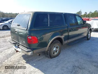 2003 Ford F-150 XLT with VIN 1FTRW07L53KA64064, listed as a IAAI auction lot 41697350 with 227,114 mi miles. Bid and sale history available at carsss.com. Image 4.