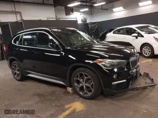 2018 BMW X1 xDrive28i with VIN WBXHT3C30J5L32576, listed as a IAAI auction lot 41767359 with 56,273 mi miles. Bid and sale history available at carsss.com. Image 1.