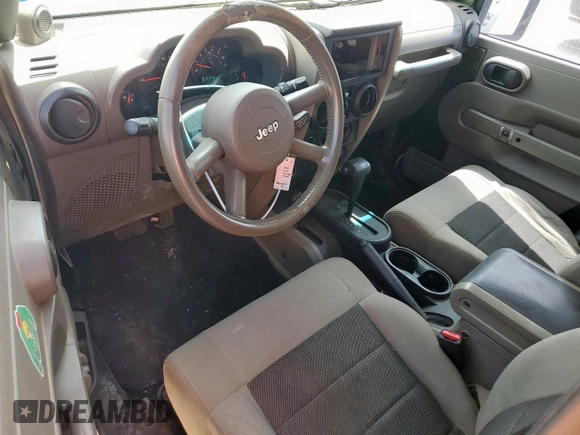 2008 Jeep Wrangler Unlimited X с VIN 1J4GA39128L537191, выставлен на аукционе Copart как лот 56844345 с пробегом 305 764 миль миль и Списание • Salvage title. История ставок и продаж доступна на DreamBid. Изображение 8.