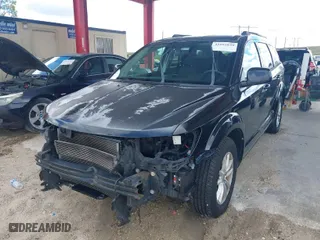2013 Dodge Journey SXT with VIN 3C4PDCBGXDT625819, listed as a IAAI auction lot 41665839 with 132,890 mi miles. Bid and sale history available at carsss.com. Image 2.
