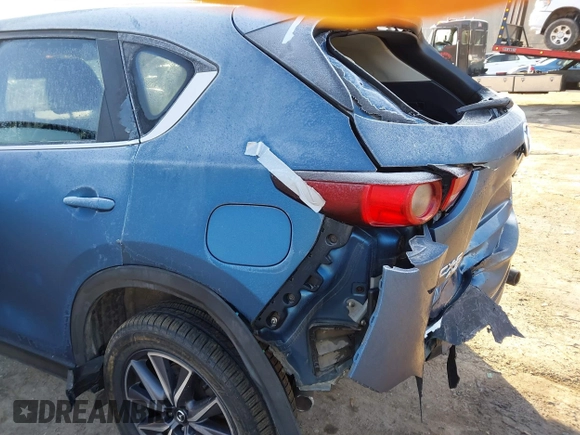 2018 Mazda CX-5 Touring z VIN JM3KFBCM2J0461954, wystawiony jako IAAI lot #41655865 z przebiegiem 129 333 mil mil oraz . Historia ofert i sprzedaży dostępna na DreamBid. Obrazek 16.