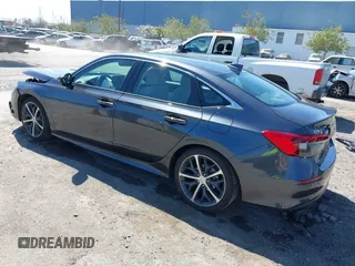 2023 Honda Civic Sedan Touring with VIN 2HGFE1F91PH310656, listed as a IAAI auction lot 41884334 with 17,691 mi miles. Bid and sale history available at carsss.com. Image 3.