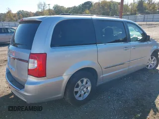 2012 Chrysler Town & Country Touring with VIN 2C4RC1BGXCR338160, listed as a IAAI auction lot 41042918 with 214,961 mi miles and . Bid and sale history available at DreamBid. Image 4.