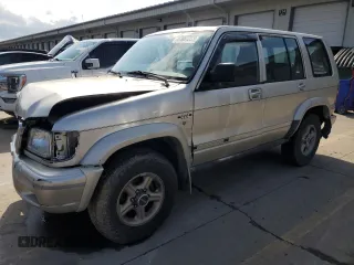 1999 Isuzu Trooper S with VIN JACDJ58X6X7924973, listed as a Copart auction lot 57881235 with 269,301 mi miles and Salvage title. Bid and sale history available at DreamBid. Image 1.