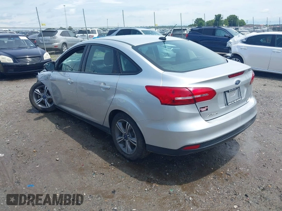 2017 Ford Focus SE with VIN 1FADP3FE4HL295573, listed as a IAAI auction lot 39562568 with 96,939 mi miles and . Bid and sale history available at carsss.com. Image 3.