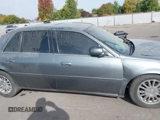 2004 Cadillac DeVille DHS z VIN 1G6KE57Y74U119605, wystawiony jako IAAI lot #40555057 z przebiegiem Nie podano mil oraz . Historia ofert i sprzedaży dostępna na DreamBid. Obrazek 13.