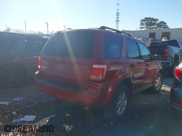 2011 Ford Escape XLT with VIN 1FMCU0D76BKB89698, listed as a IAAI auction lot 41073661 with 124,479 mi miles. Bid and sale history available at carsss.com. Image 4.