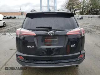 2018 Toyota RAV4 XLE with VIN 2T3RFREVXJW723057, listed as a Copart auction lot 49176705 with 5,980 mi miles and Salvage Title. Bid and sale history available at DreamBid. Image 6.