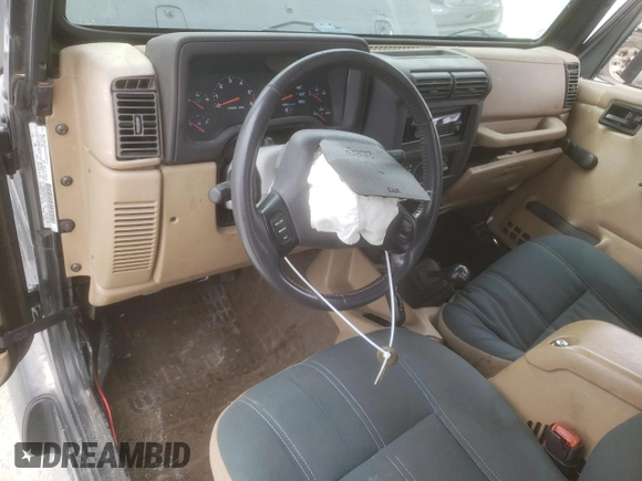 2002 Jeep Wrangler Sahara with VIN 1J4FA59S42P720513, listed as a Copart auction lot 47054805 with 190,922 mi miles and Salvage title. Bid and sale history available at DreamBid. Image 8.