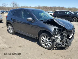 2014 Mazda CX-5 Grand Touring with VIN JM3KE4DY4E0422739, listed as a Copart auction lot 53234745 with 54,152 mi miles and Salvage Title. Bid and sale history available at carsss.com. Image 4.