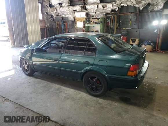 1996 Toyota Tercel DX z VIN JT2BC52L7T7044201, wystawiony jako Copart lot #77190074 z przebiegiem Nie podano mil oraz Szkoda całkowita • Salvage title. Historia ofert i sprzedaży dostępna na DreamBid. Obrazek 2.
