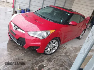 2013 Hyundai Veloster w/Gray Int with VIN KMHTC6AD4DU092345, listed as a IAAI auction lot 41382227 with 134,621 mi miles. Bid and sale history available at carsss.com. Image 2.