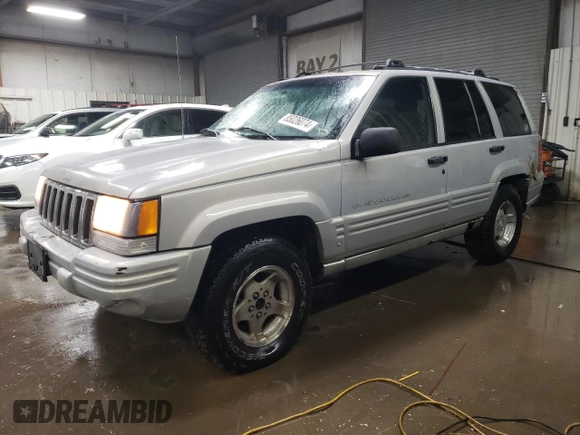 1998 Jeep Grand Cherokee Laredo with VIN 1J4GZ48S3WC269693, listed as a Copart auction lot 85026074 with 308,791 mi miles and Salvage Title. Bid and sale history available at carsss.com. Image 1.
