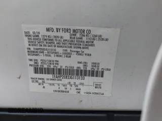 2018 Ford Taurus SEL with VIN 1FAHP2E82JG113133, listed as a IAAI auction lot 41240201 with 146,015 mi miles. Bid and sale history available at carsss.com. Image 9.