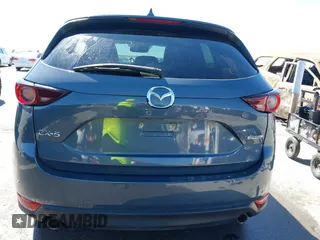 2021 Mazda CX-5 Touring with VIN JM3KFACM1M0317763, listed as a IAAI auction lot 41775712 with 75,068 mi miles. Bid and sale history available at carsss.com. Image 16.