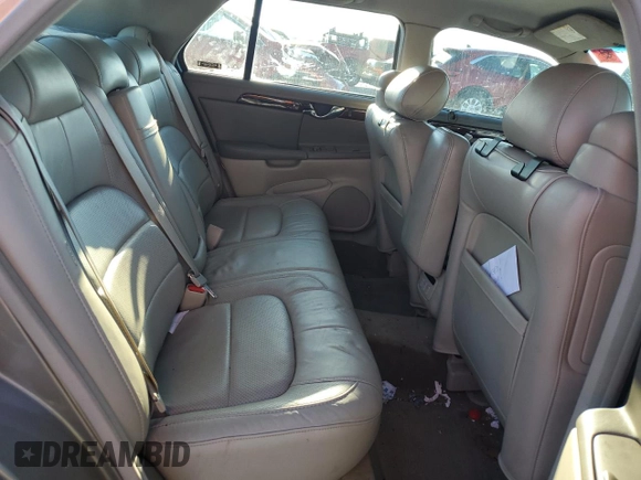 2003 Cadillac DeVille DTS z VIN 1G6KF57963U125853, wystawiony jako Copart lot #42559975 z przebiegiem Nie podano mil oraz Szkody całkowita. Historia ofert i sprzedaży dostępna na DreamBid. Obrazek 10.