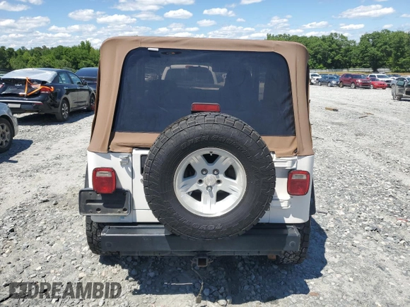 2004 Jeep Wrangler Sport with VIN 1J4FA49S94P751849, listed as a Copart auction lot 55519445 with 139,854 mi miles and Salvage title. Bid and sale history available at DreamBid. Image 6.