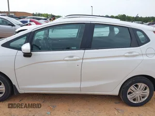 2019 Honda Fit LX z VIN 3HGGK5H4XKM704303, wystawiony jako IAAI lot #42019753 z przebiegiem 137 271 mil mil oraz . Historia ofert i sprzedaży dostępna na DreamBid. Obrazek 14.