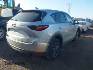 2020 Mazda CX-5 Touring with VIN JM3KFACM5L0766698, listed as a IAAI auction lot 42006157 with 80,288 mi miles and . Bid and sale history available at carsss.com. Image 4.