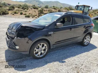 2013 Ford Escape SE with VIN 1FMCU9G91DUC25077, listed as a Copart auction lot 60888305 with 212,409 mi miles and Salvage title. Bid and sale history available at DreamBid. Image 1.