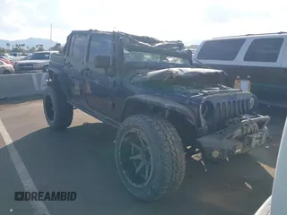 2014 Jeep Wrangler Unlimited Sahara z VIN 1C4BJWEG3EL136028, wystawiony jako IAAI lot #41459481 z przebiegiem 133 501 mil mil oraz . Historia ofert i sprzedaży dostępna na DreamBid. Obrazek 1.
