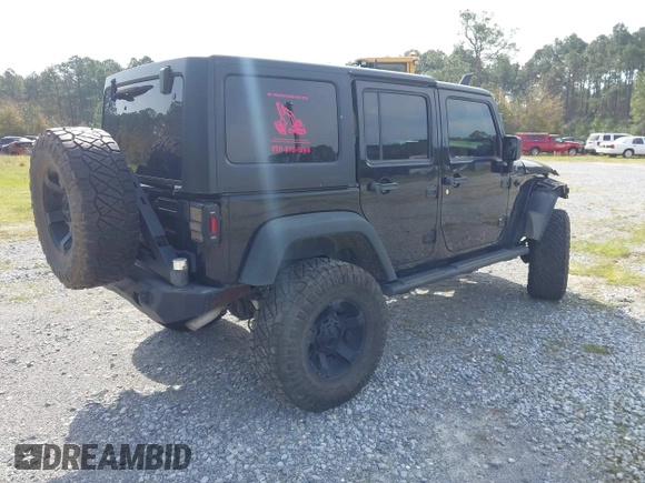 2012 Jeep Wrangler Unlimited Sport with VIN 1C4BJWDG2CL258264, listed as a IAAI auction lot 41880235 with 173,661 mi miles. Bid and sale history available at carsss.com. Image 4.