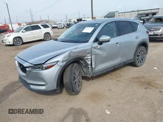 2017 Mazda CX-5 Grand Touring with VIN JM3KFBDL8H0227348, listed as a IAAI auction lot 41572377 with 124,908 mi miles. Bid and sale history available at carsss.com. Image 2.
