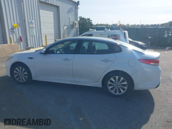 2016 Kia Optima EX with VIN 5XXGU4L32GG070138, listed as a IAAI auction lot 42138810 with 131,040 mi miles. Bid and sale history available at carsss.com. Image 14.