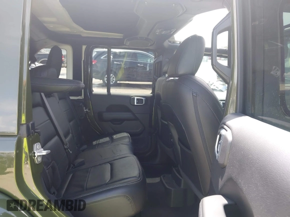 2022 Jeep Wrangler Unlimited Sahara Altitude with VIN 1C4HJXEG3NW194042, listed as a IAAI auction lot 42643314 with 32,091 mi miles and . Bid and sale history available at DreamBid. Image 8.