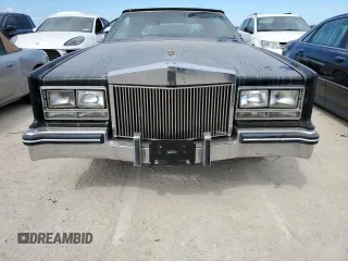 1985 Cadillac Eldorado z VIN 1G6EL578XFE614641, wystawiony jako Copart lot #75663984 z przebiegiem 54 128 mil mil oraz Szkody całkowita. Historia ofert i sprzedaży dostępna na DreamBid. Obrazek 5.