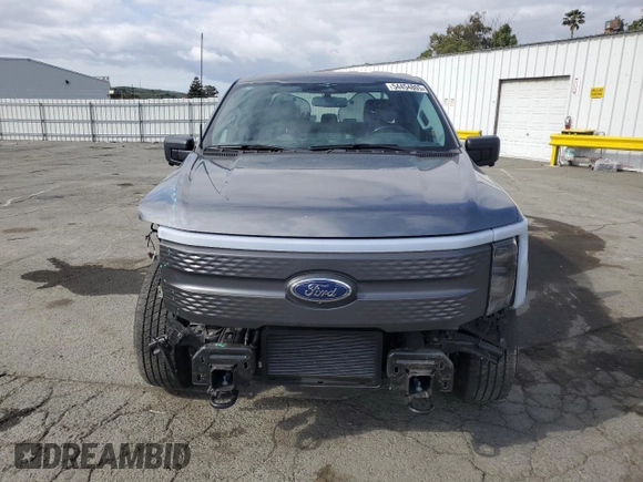 2023 Ford F-150 Lightning Pro with VIN 1FT6W1EV0PWG34788, listed as a Copart auction lot 54454805 with 11,432 mi miles and Salvage title. Bid and sale history available at DreamBid. Image 5.
