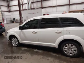 2015 Dodge Journey American Value z VIN 3C4PDCAB4FT714200, wystawiony jako IAAI lot #42199910 z przebiegiem 205 009 mil mil oraz . Historia ofert i sprzedaży dostępna na DreamBid. Obrazek 14.