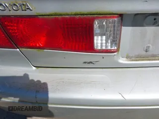 2000 Toyota Camry CE z VIN JT2BG22K6Y0451632, wystawiony jako IAAI lot #42030842 z przebiegiem 200 734 mil mil oraz . Historia ofert i sprzedaży dostępna na DreamBid. Obrazek 13.