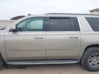 2015 GMC Yukon XL SLE z VIN 1GKS1GKC1FR155056, wystawiony jako IAAI lot #41517607 z przebiegiem 174 634 mil mil oraz . Historia ofert i sprzedaży dostępna na DreamBid. Obrazek 14.