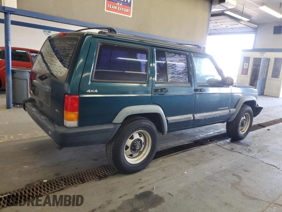 1997 Jeep Cherokee SE with VIN 1J4FJ28S0VL551442, listed as a Copart auction lot 49215195 with 164,356 mi miles and Salvage Title. Bid and sale history available at carsss.com. Image 3.