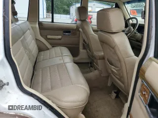1990 Jeep Grand Wagoneer z VIN 1J4FN78L0LL282169, wystawiony jako Copart lot #59809545 z przebiegiem 194 382 mil mil oraz Czysty tytuł • Clean title. Historia ofert i sprzedaży dostępna na DreamBid. Obrazek 11.