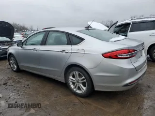 2018 Ford Fusion SE z VIN 3FA6P0H79JR270777, wystawiony jako Copart lot #45319755 z przebiegiem 69 152 mil mil oraz Szkoda całkowita • Salvage title. Historia ofert i sprzedaży dostępna na DreamBid. Obrazek 2.
