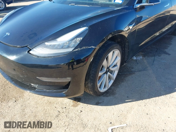 2018 Tesla Model 3 Long Range Battery with VIN 5YJ3E1EA2JF014975, listed as a IAAI auction lot 41319407 with 106,301 mi miles and . Bid and sale history available at DreamBid. Image 6.