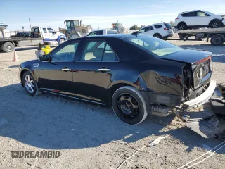 2009 Cadillac STS AWD z VIN 1G6DD67V690120833, wystawiony jako Copart lot #42502345 z przebiegiem 100 250 mil mil oraz Szkoda całkowita • Salvage title. Historia ofert i sprzedaży dostępna na DreamBid. Obrazek 2.