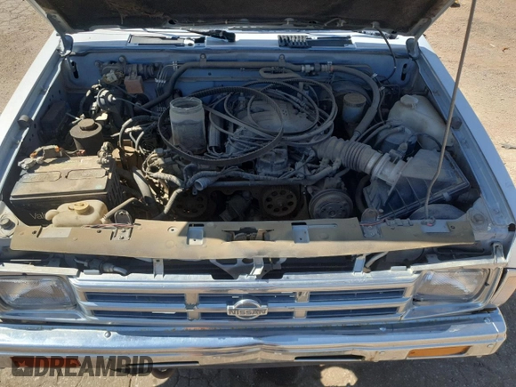 1992 Nissan Frontier SE z VIN 1N6HD16Y8NC358458, wystawiony jako Copart lot #62064905 z przebiegiem 226 678 mil mil oraz Czysty tytuł • Clean title. Historia ofert i sprzedaży dostępna na DreamBid. Obrazek 11.