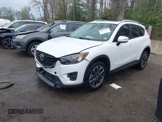 2016 Mazda CX-5 Grand Touring with VIN JM3KE4DY3G0838204, listed as a IAAI auction lot 41961049 with 98,918 mi miles and . Bid and sale history available at carsss.com. Image 17.