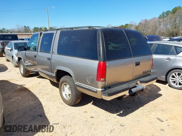 1999 Chevrolet Suburban with VIN 3GNEC16R1XG198724, listed as a IAAI auction lot 41812563 with 207,922 mi miles. Bid and sale history available at carsss.com. Image 3.