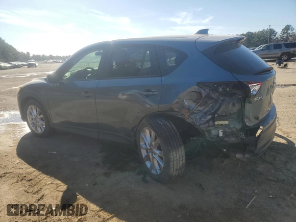 2015 Mazda CX-5 Grand Touring with VIN JM3KE2DY9F0483509, listed as a Copart auction lot 87406944 with 176,213 mi miles and Salvage Title. Bid and sale history available at carsss.com. Image 2.