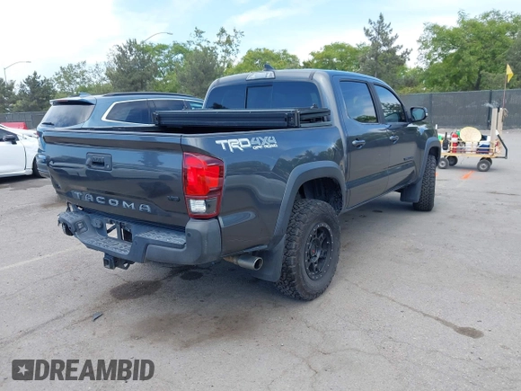 2019 Toyota Tacoma SR with VIN 3TMCZ5AN3KM207783, listed as a IAAI auction lot 42375280 with 55,784 mi miles and . Bid and sale history available at DreamBid. Image 4.
