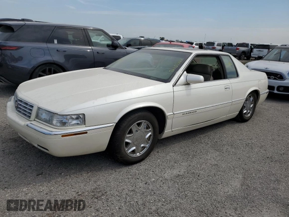 1999 Cadillac Eldorado z VIN 1G6EL12Y7XU615169, wystawiony jako Copart lot #76459744 z przebiegiem Nie podano mil oraz Szkoda całkowita • Salvage title. Historia ofert i sprzedaży dostępna na DreamBid. Obrazek 1.